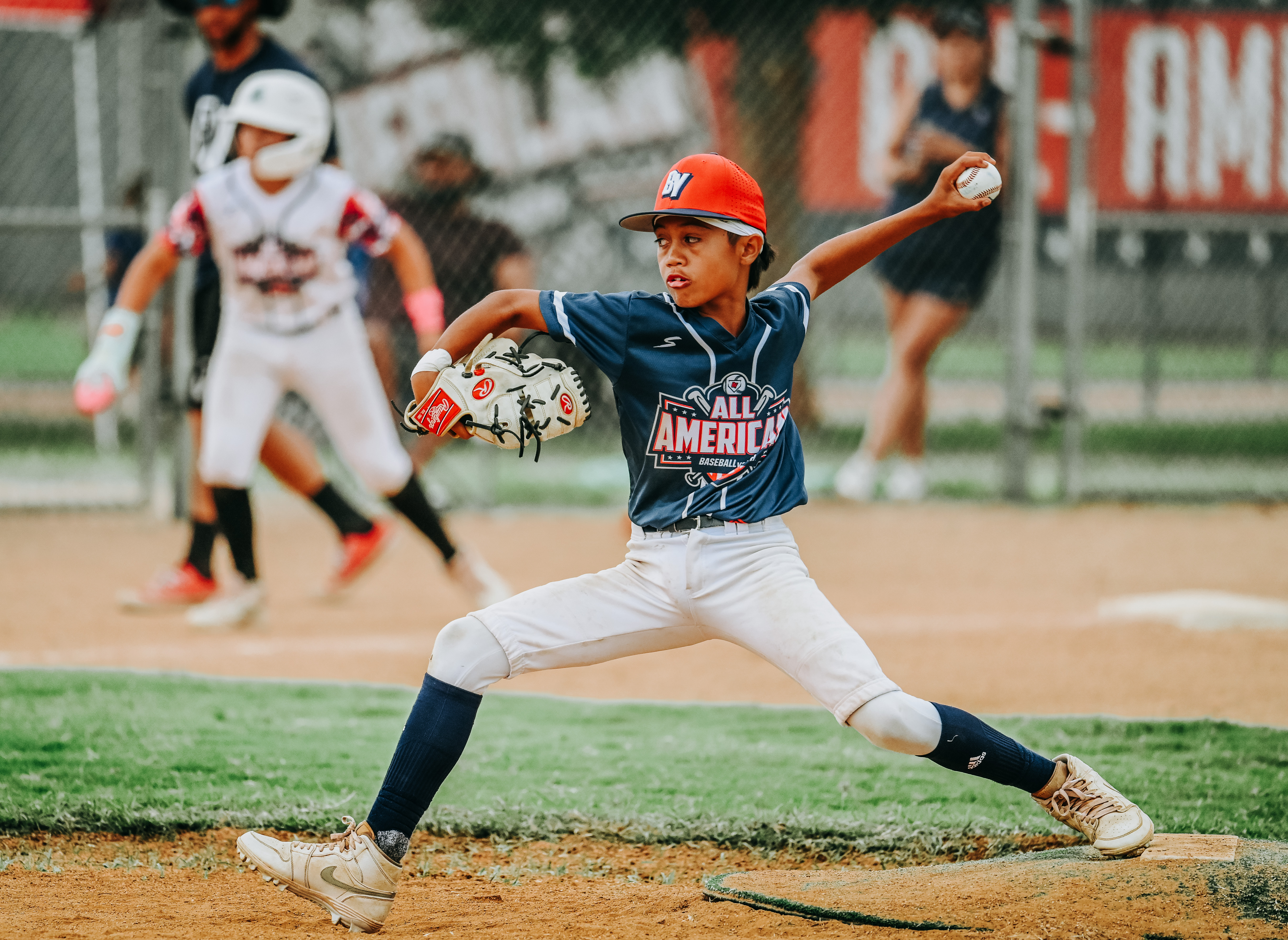 Youth baseball pitcher action photography